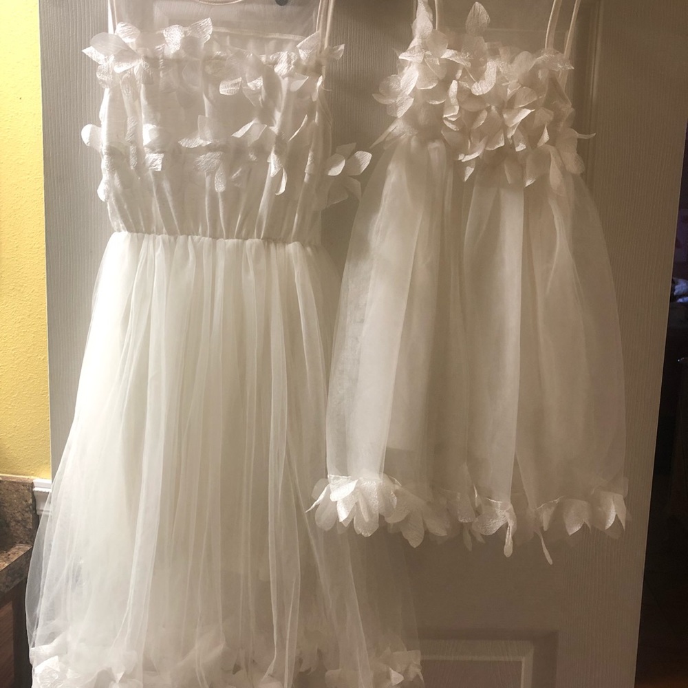 Beautiful white dresses mom and Daughter.